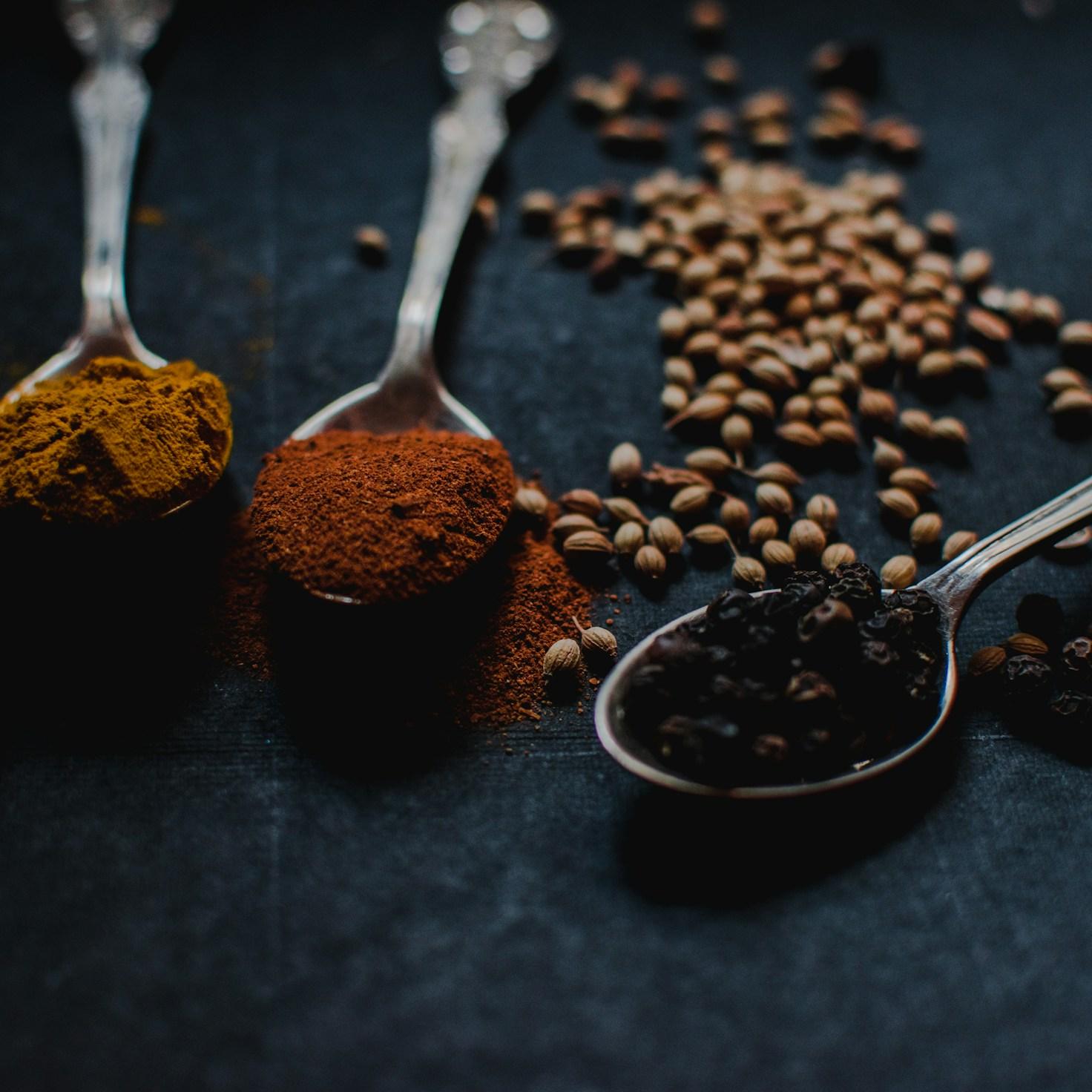 Diverse group of community members sharing a meal together, showcasing the social bonds formed through collaborative cooking